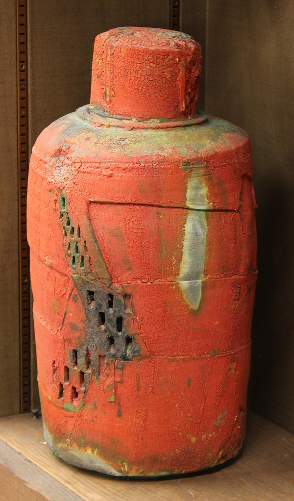 Kris Cox lidded ceramic vessel: Lidded ceramic vessel executed by Kris Cox, 1983 '' Red Stoppered Bottle #8'' the crimson body of cylindrical form having an organic matte glaze on a textured ground, retailed at Gumps, San Francisco,