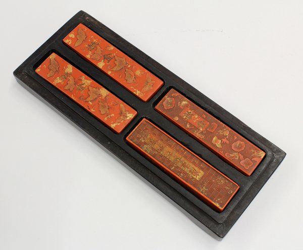 Chinese Cinnabar Ink Stick in Wood Box: Chinese four gilt-accented cinnabar ink sticks and wood box, each of the rectangular bars fronted with the characters 'shujin' and reversed by 'hui cheng Wang Jinsheng zhi' and accompanied by an apocr