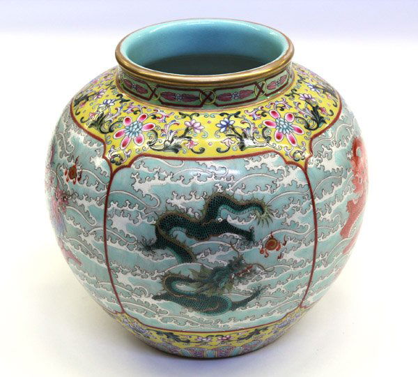 Chinese Enameled Porcelain 'Dragon' Jar: Chinese polychrome enameled porcelain jar, the globular body with five reserves each of a dragon emerging from crashing waves in pursuit of a jewel, set against a yellow ground, brightly enameled with
