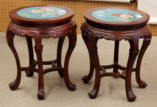 Two Chinese Stools with Cloisonne Enameled Plaque: (Lot of 2) Chinese wooden stools with cloisonne enamel plaques, 20th century, each plaque brightly enameled with a pair of birds amid lush peony blossoms and rock work on a cloud patterned turquoise g
