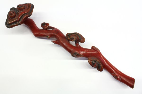 Chinese Lacquered Wooden Ruyi Scepter: Chinese red lacquered wood ruyi scepter, carved with a lobed head issuing from a gnarled branch with small lingzhi sprigs (repair), 15.75''w