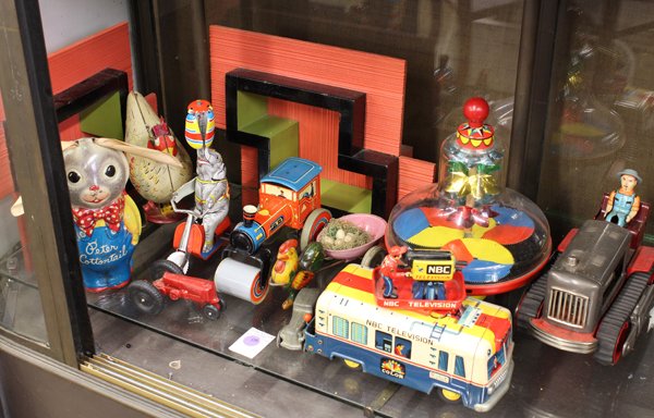 Associated collection of vintage toys: (lot of 10) Associated collection of vintage tin toys, comprising (among others) a whirligig, a circus elephant riding the bike, a chicken, a NBC televion station on wheels, a bunny called Peter Cotto