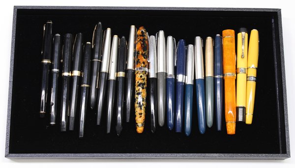 Associated set of fountain pens: (lot of 22) Collection of fountain pens, including one Conway Stewart fountain pen with 18K gold nib; a yellow Waterman pen with 18K nib, a Laban fountain pen with 18K gold nib and a black 14K gold ni