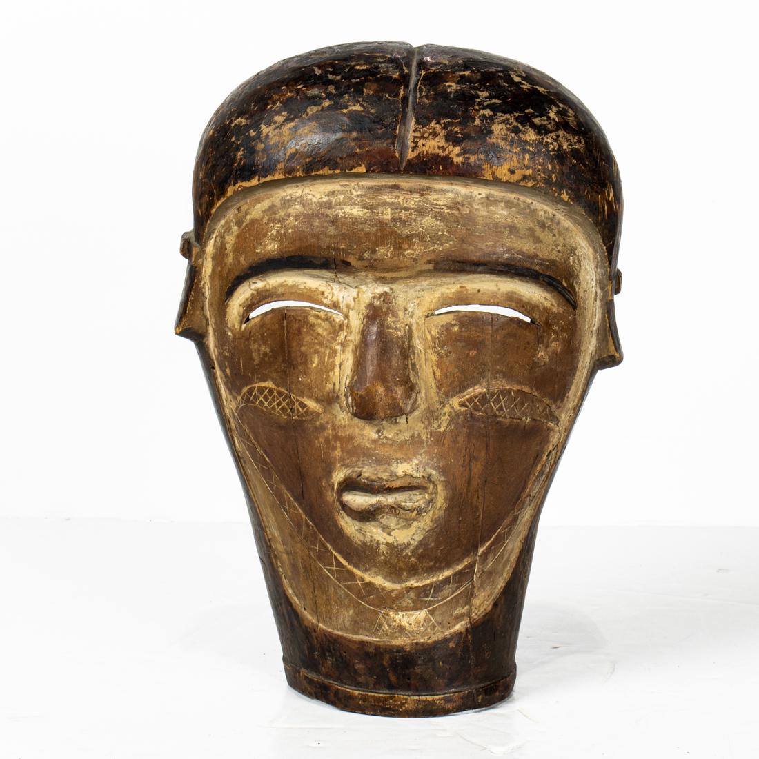 A Northern Zaire golden brown mask with weak chin (1 of 2)