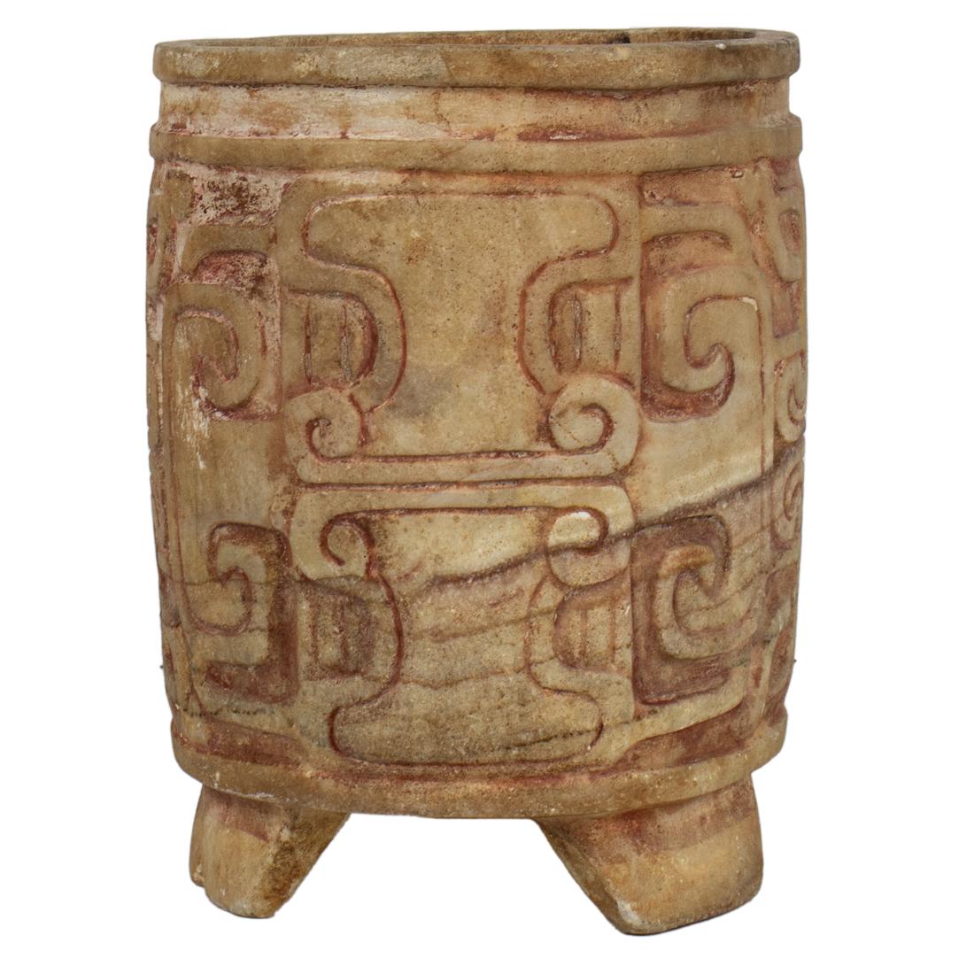 An elegant and impressively carved stone tripod vessel with traces of polychrome (1 of 3)