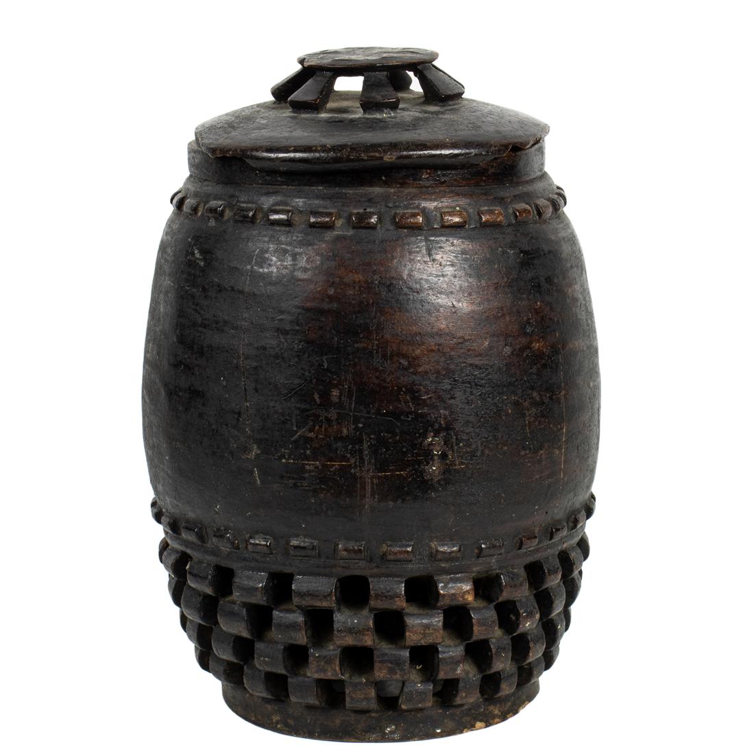 A finely carved container with lid: A finely carved container with lid, Lozi or Rotse people in several southern African nations, 10.5"h x 7" dia Provenance: Collection of Vanna and N. Lee Lacy (Palm Springs, California). Mr. Lacy was a