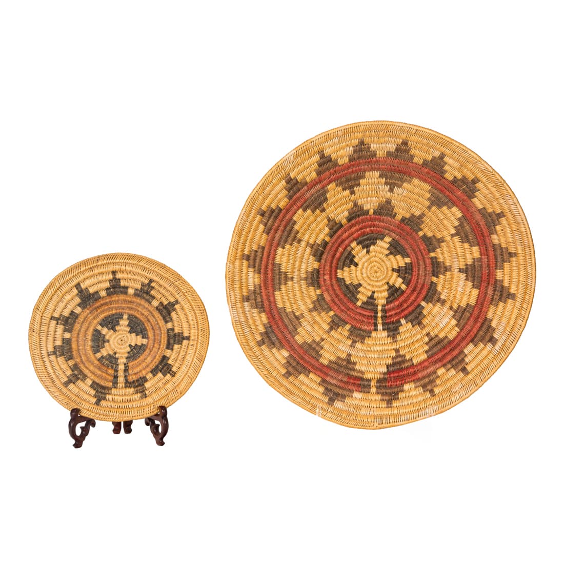Two large Navajo ceremonial trays, each with a radiating floral design (1 of 2)