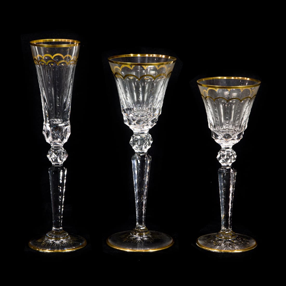A St. Louis suite of gilt cut glass stemware in the Excellence pattern: A St. Louis suite of gilt cut glass stemware in the Excellence pattern, comprising (12) goblets, 10"h; (12) champagne flutes, 10.75"h and (13) wine, 8.75"h [37]. Provenance: Property of a prominent Hi
