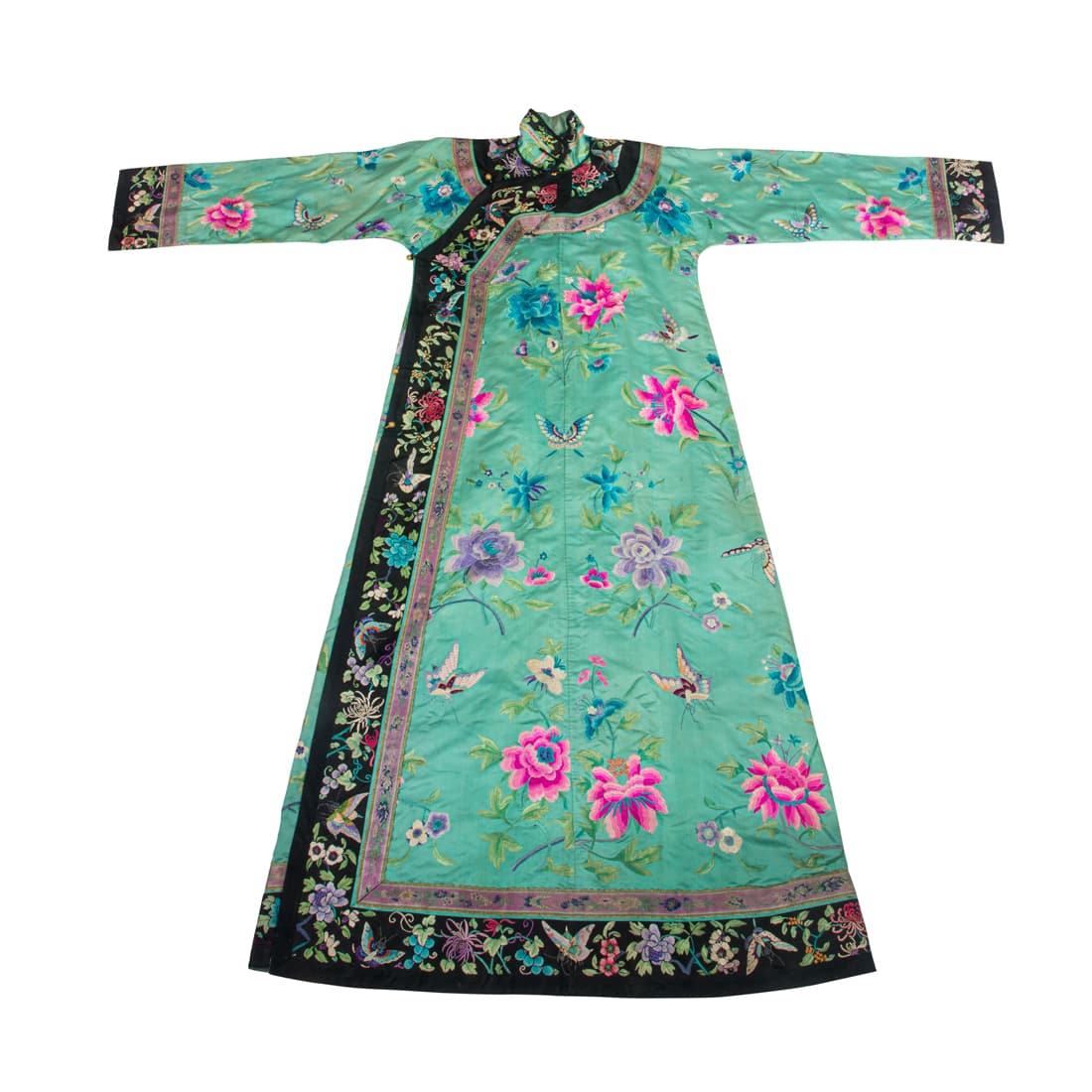 A Chinese embroidered lady's turquoise-ground silk robe: A Chinese embroidered lady's turquoise-ground silk robe, the slender robe with a right side opening, worked on a turquoise-green ground in bright- colored silk floss, embroidered with pleasant floweri