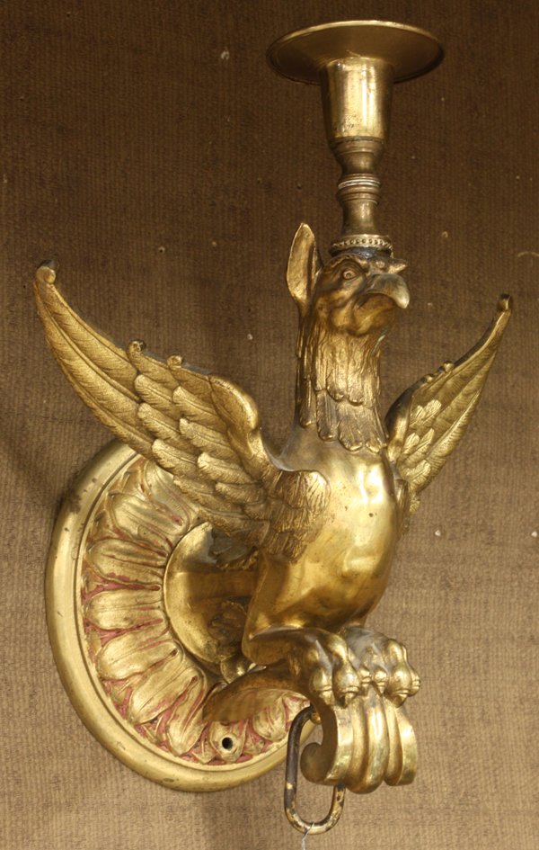 Continental gilt bronze wall sconces: Pair of Continental gilt bronze wall sconces circa 1860, executed in the Renaissance style, and having a single light surmounting the winged griffin standard depicted with wings outstretched and perch