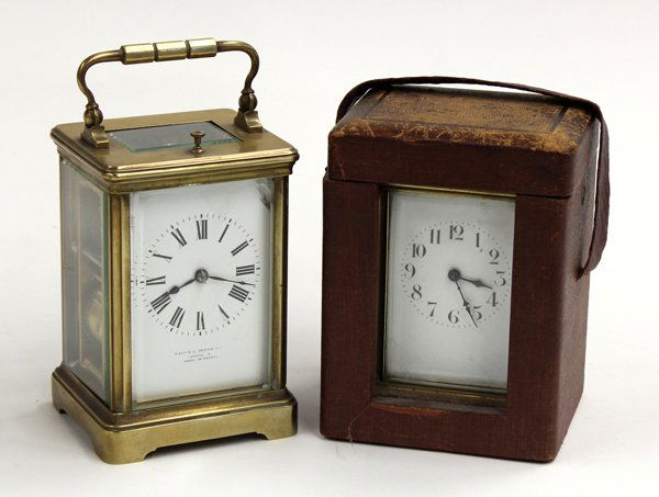 French carriage clock group: (lot of 2) French carriage clock group, one having an enamel decorated case with Roman markers surmounting Mappin & Webb, London, and housed in a bevelled glass and brass footed case 5''h, together wi