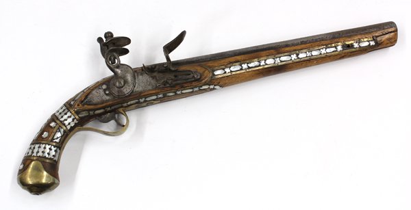Middle Eastern flintlock pistol: Middle Eastern flintlock pistol, probably late 18th/early 19th century, with a 11.75'' octagonal barrel, the lock with engraved marks, the stock and ball butt decorated with brass, and inlaid mother-o