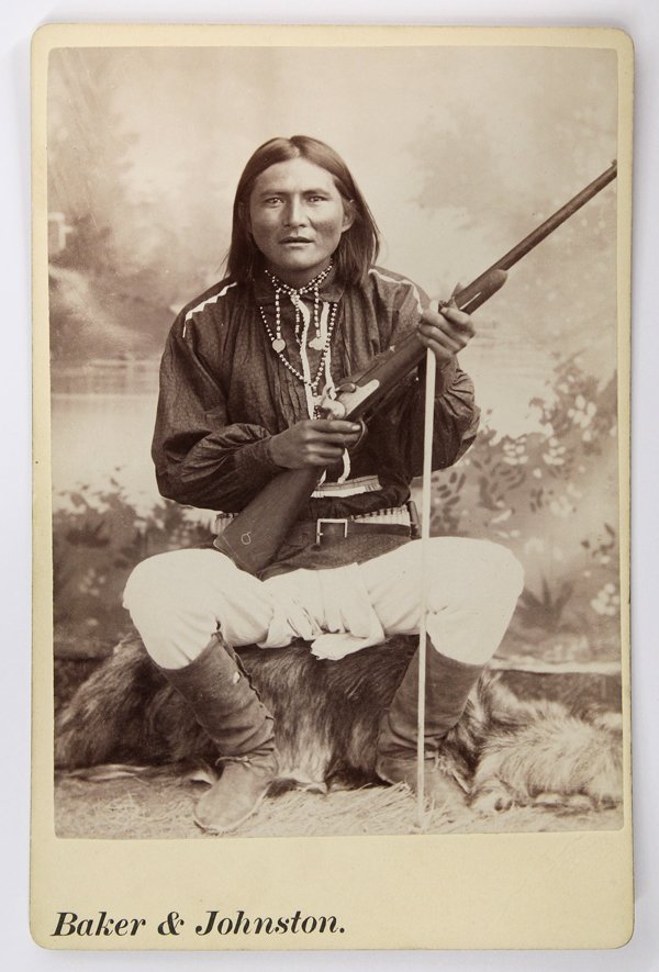 Cabinet Card, Apache, Baker and Johnston: Cabinet card depicting an Apache chief, by Baker and Johnston, inscribed ''Al-Chi-Say Chief of White Mt. Apaches'' on label verso, with Baker and Johnston imprint on mount below photograph, overall: 6