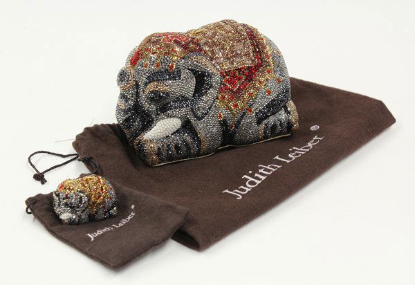Judith Leiber Elephant Minaudiere: (lot of 2) Judith Leiber full bead Elephant Minaudiere evening bag together with a corresponding pill box, The hinged box opening to a golden leather interior, having shoulder strap, with Judith Leibe