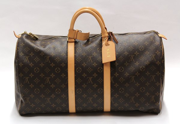 Louis Vuitton duffle bag: Louis Vuitton Monogram Canvas Duffle Bag, having lock and key, serial # SD1023, 55 x 30cm, with original box