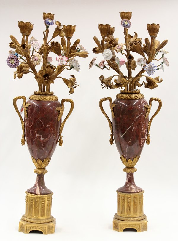 Louis XVI style candelabra: Pair of Louis XVI style gilt bronze candelabra, the five lights modeleld as flowering lillies, surmounting the naturalistic arms accented with polychrome decorated prcelain floral sprays above the han