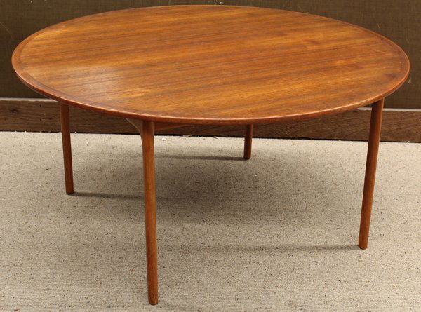 Ole Wanscher table: Mid-century Danish modern teak table by Ole Wanscher for P. Ieppesen Danmark, having a circular top rising on stylized legs, bears marks to underside, 21''h x 43''w