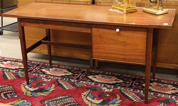 Danish teak desk: Drexel teak desk, having a rectangular top with ebony banding above the two drawer case and rising on square tapered legs, marked on base 28.5''h x 60''w x 24''d