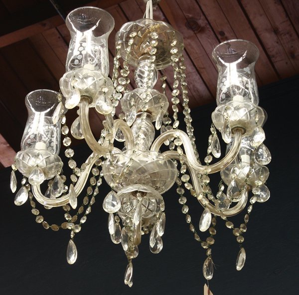 Venetian style chandelier: Venetian style crystal chandelier, the five light fixture having crystal swags conjoining the five arms having suspended drops continuing to the shaped standard, 22''h x 20''w