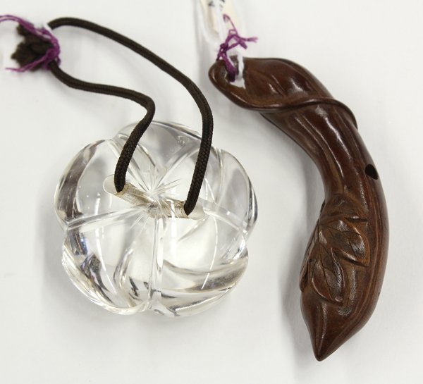 Two Japanese Netsuke, Crystal/Boxwood: (Lot of 2) Japanese netsuke, the first of a 19th century carved boxwood toggle carved as a gourd, 2.5''; the second a rock crystal stylized five-petal blossom, 1.5''; Provenance: Unaccessioned items f