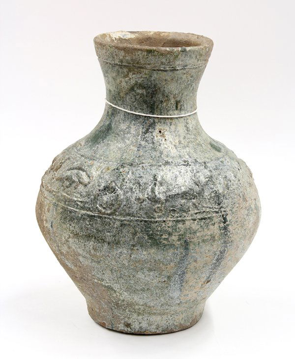 Chinese Han Green Glazed Jar: Chinese green glazed red earthenware jar, Han dynasty, the sloping shoulders with a wide band molded with mythical beasts bracketed by zoomorphic mock loose ring handles, set below a waisted neck inci