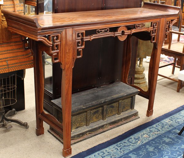 Chinese Hardwood Altar Table: Chinese hardwood altar table, the rectangular top flanked by a pair of swallow tail terminals, and fronted with an apron centered by a bi-disk linked to squared scrolls repeated on the side spandrels 