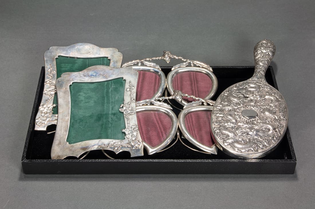 Five Chinese export silver items: two pairs of frames and a dragon hand mirror (1 of 2)
