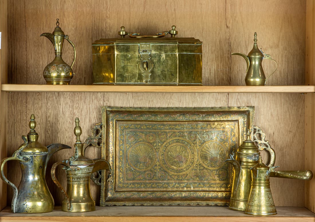 Group of Middle Eastern brass and white metal articles, including a tea tray with peacock medallions (1 of 1)