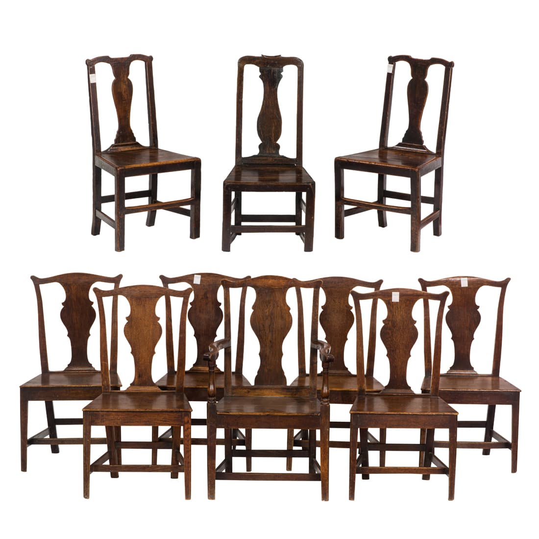 Group of English oak dining or pub chairs 18th century: Group of English oak dining or pub chairs 18th century, each having a shaped splat, consisting of (7) matching examples, together with associated chairs including one armchair, each: 36.5"h [lot of 10