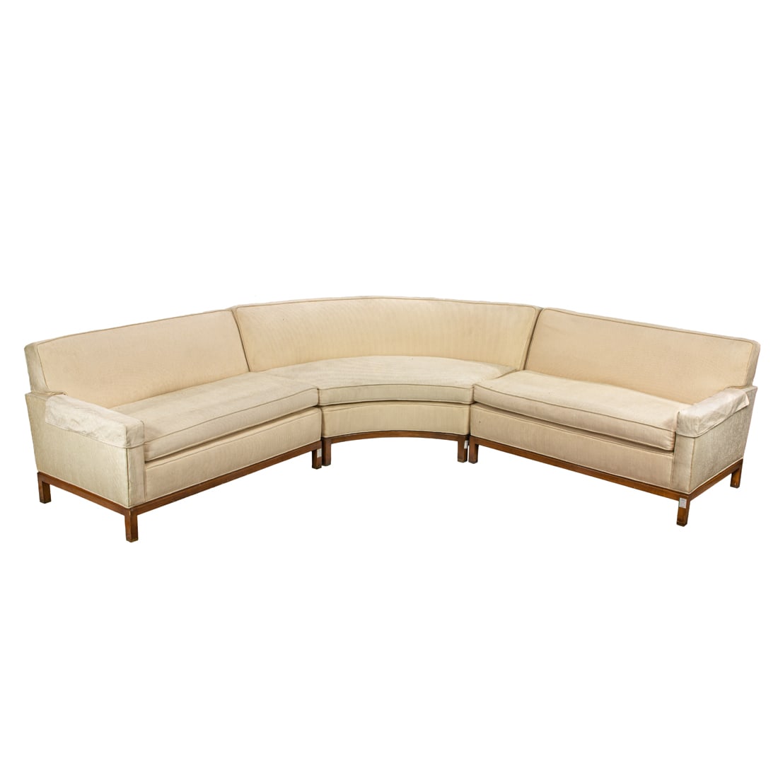 Modern cream upholstered curved three-part sofa: Modern cream upholstered curved three-part sofa, attributed to Michael Taylor, unmarked, comprising (2) single arm sofas 31"h x 48"w x 32"d and (1) curved bench 31"h x 73"w