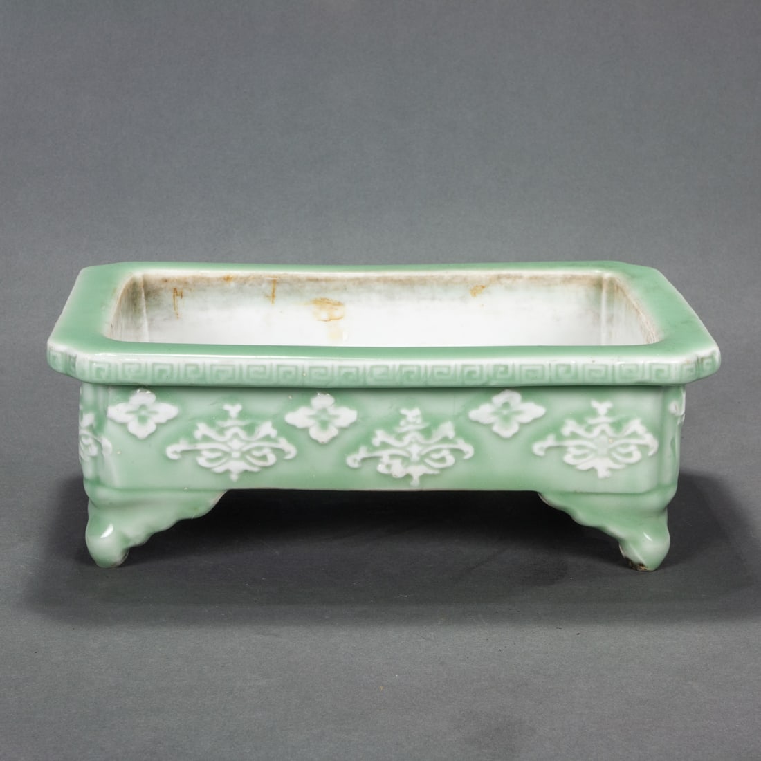 Chinese celadon glazed and molded jardiniere: Chinese celadon glazed and molded jardiniere, 12" wide.
