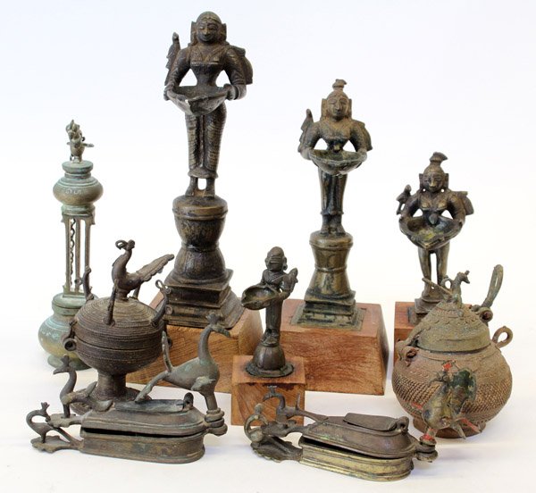 Four East Indian Metal Lamps/Boxes: (Lot of 4) East Indian bronze/copper alloy lamps and covered containers, consisting of two stationary lamps cast as a standing female holding a receptacle, one circular box with bird finial on the hin