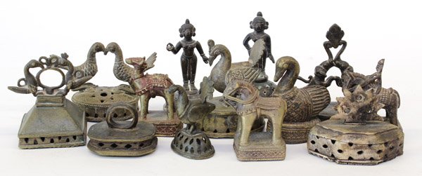 East Indian Metal Stamps/Rattles: (Lot of 13) Group of East Indian metal stamps, possibly for fabric patterns, each also functioning as a rattle, of various shapes and sizes, the finials including figures, horses, elephants, birds; la