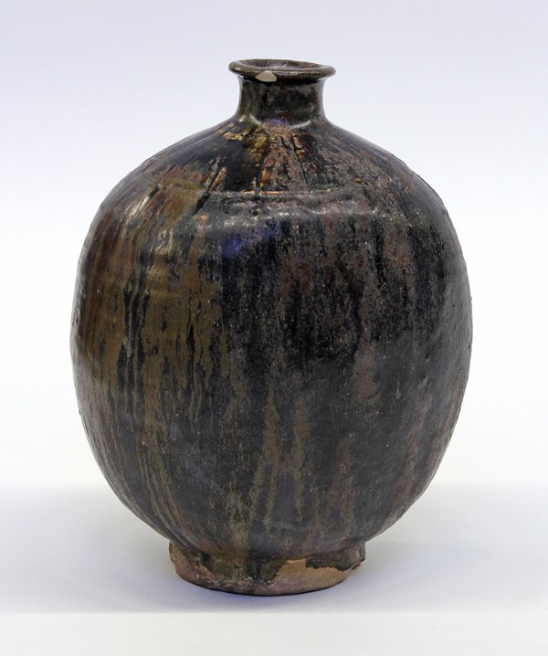 Korean Brown Glazed Stoneware Bottle: Korean brown glazed stoneware bottle, of flattened ovoid shape with a short waist neck centered by incised radiating lines stopping short of the shoulder, the exterior covered with a mottled brown and