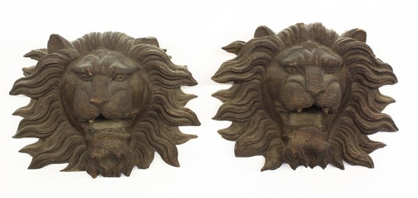 Relief carved lion head mounts: Pair of carved wood lion head mounts circa 1890, each depicted with a determined look and jaws in roar form, 8''h x 11''w (losses)