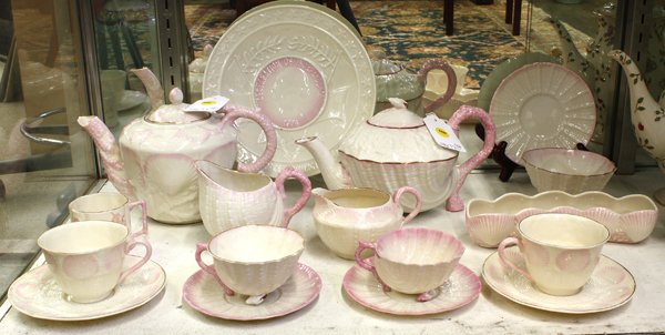 Belleek porcelain group: (lot of 17) Belleek porcelain group, each having a polychrome decorated surface on the parian body, including cups and saucers, creamers, tea pots, a plate commemorating the American Declaration of In