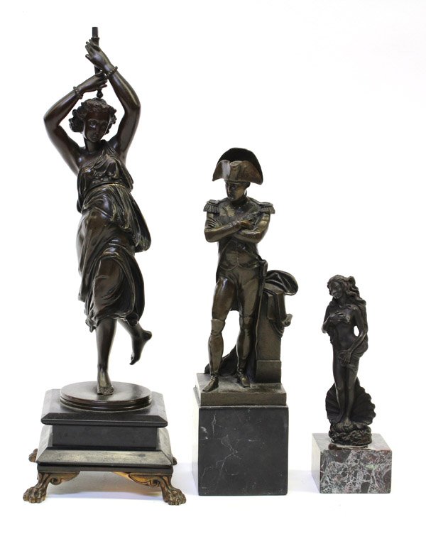 Patinated bronze group: (lot of 3)Continental patinated bronze group consisting of Napoleon Bonaparte, depicted in the classic pose and rising on a square plinth 12''h, Venus Di Milo 7''h, and a Dancing Muse by Paul Emile Ma