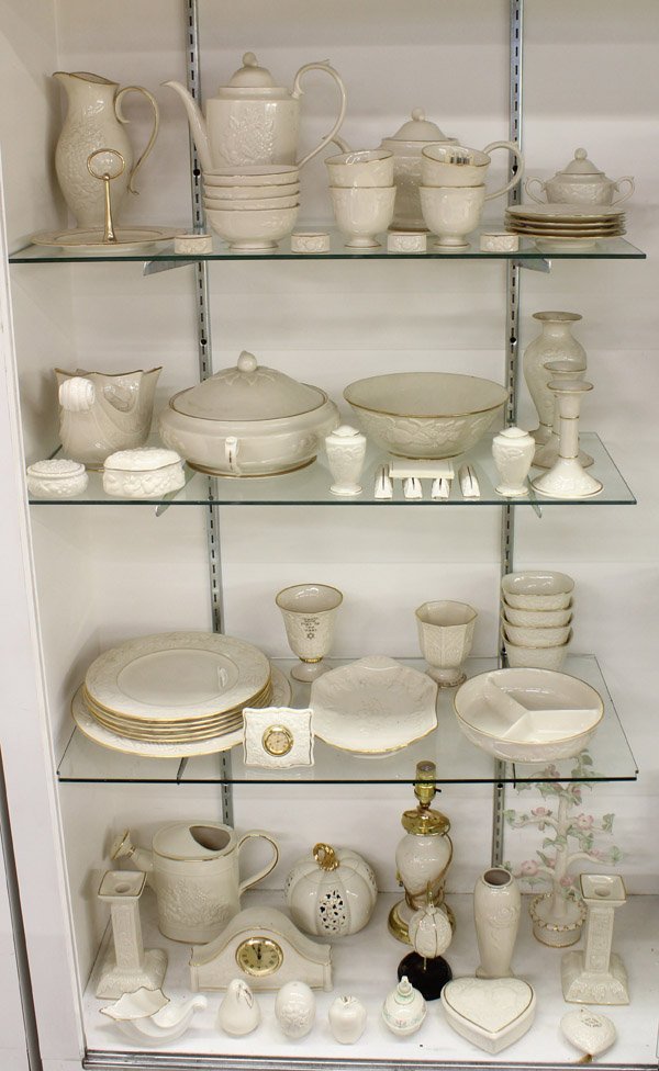Lenox porcelain group: (lot of 62) Large grouping of Lenox porcelain, mostly in the ''Fruits of Life'' pattern, including coffee and tea pots, napkin rings, candlesticks, placecard holders, dinner plates, berry bowls, a wat