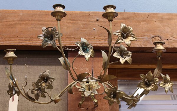 gilt metal wall sconce: Pair of Continental gilt metal wall sconces executed in the Rococo taste, the four lights rising on naturalistic arms having lilly sprays continuing to the bow form mount, 11''h x 21''w