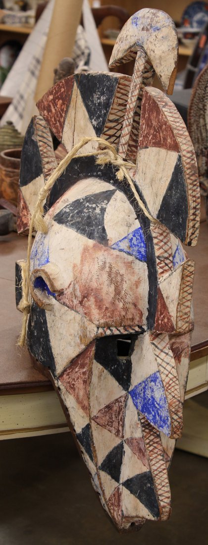 West African dance mask: Bobo tribe, West Africa dance mask decorated with black, red, blue, and white geometric pigments, 27"l Provenance: Lloyd Morain ethnographic collection, Carmel, CA.
