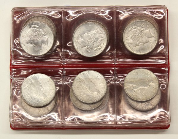 Lot of US silver dollars dating from 1877-1926: (Lot of 30) Common date and mint marked U.S. silver dollars dating from 1877 to 1926. The 1877 ''S'' trade dollar has (2) large test cut marks on the obverse, the (9) Morgan dollars 1880 to 1921 range