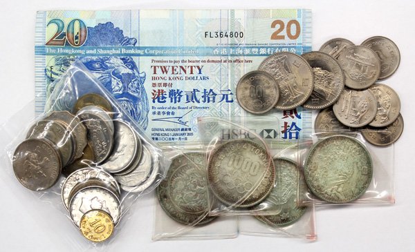 World coins and 1 Hong Kong $20 bank note: World coins consisting of a silver (1) yen Japan year 24 (1891) (3) 1964 Japan 1000 yen, Mt Fuji commemoratives, together with (2) small bags of base metal modern world coins (mostly Asian) and a Hong