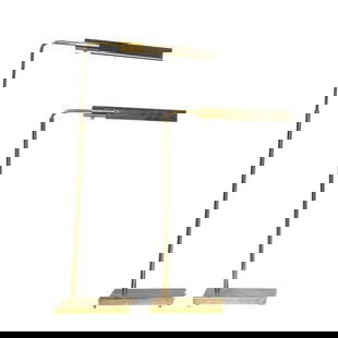 A pair of Contemporary adjustable lacquered brass reading floor lamps: A pair of Contemporary adjustable lacquered brass reading floor lamps, retailer's sticker for Casella Lighting, San Francisco, adjustable 32"h to 46"h