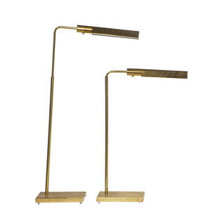 A pair of Contemporary adjustable lacquered brass reading floor lamps: A pair of Contemporary adjustable lacquered brass reading floor lamps, retailer's sticker for Casella Lighting, San Francisco, adjustable 32"h to 46"h