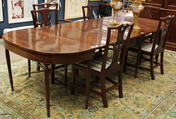 Federal style dining suite: (lot of 9) Federal style mahogany D-end dining room suite, 19th century, the oval table in three parts, having single board tops, consisting of two demi lune tables, the center a drop leaf conjoining 