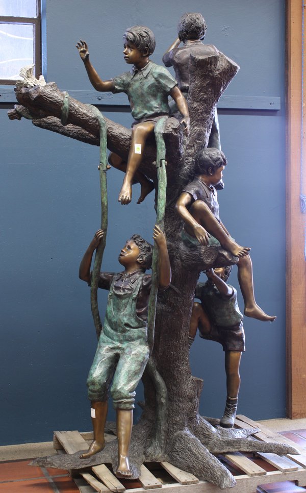 Patinated Bronze Figural Sculpture: Patinated bronze figural sculpture the life sized model depicting children at play, seated on a tree, one riding an articulated swing and rising on a naturalistic base, signed Giovanni P., Las Vegas, 