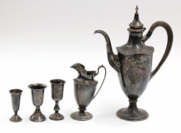 Silver tale accessories: (lot of 5) Silver table accessories consisting of Gorham sterling silver beverage pot with wood handle and cream jug (pot lacking pin for hinge); together with three associated cordials including two