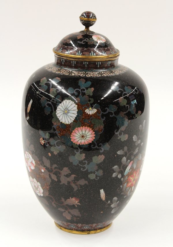 Japanese Cloisonne Enamel Urn, Meiji: Japanese cloisonne enamel decorated covered urn, Meiji period, the globular body decorated with scattered floral roundels issuing leafy tendrils, executed in colored enamels flecked with gold stone an