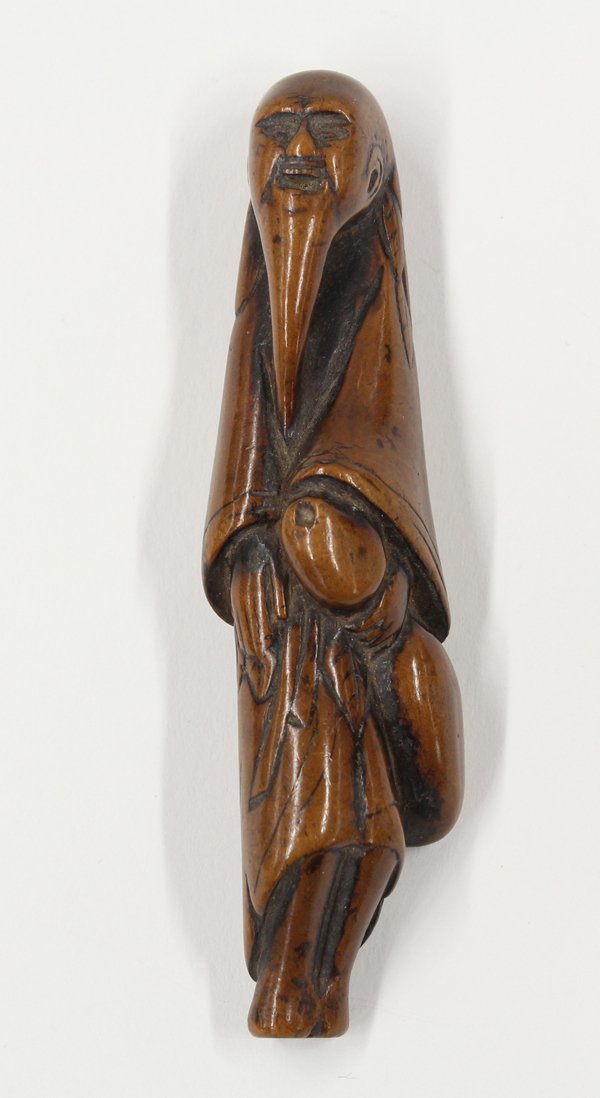 Japanese Boxwood Figural Netsuke, Edo: Japanese boxwood figural netsuke, Edo period, 18th century, carved as a bearded Chinese sage standing with a drinking gourd held in his left hand and wearing the mugwort cape and apron of a hermit, 4'