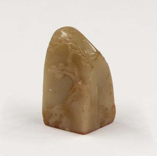 Chinese Small Tan Soapstone Seal, Pine: Chinese small soapstone seal, with a canted mountain peak top and carved with a gnarled pine framing a villa below, executed in low relief, the reverse depicting a hilltop with foliage, the tan colore